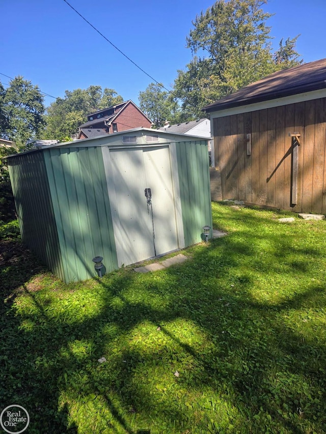 view of outbuilding with a lawn