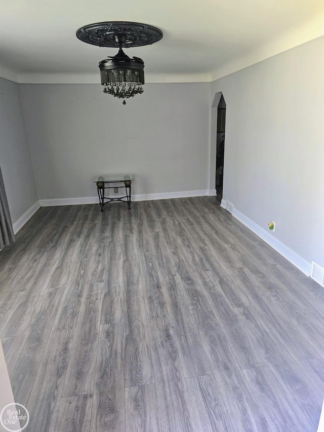 empty room with hardwood / wood-style floors