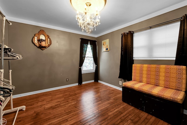 living area with an inviting chandelier and dark hardwood / wood-style floors