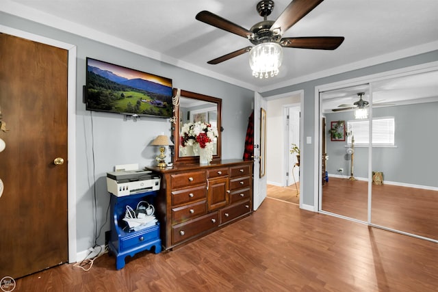 bedroom featuring hardwood / wood-style flooring, a closet, and ceiling fan