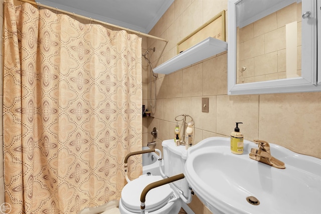 bathroom featuring curtained shower, tasteful backsplash, sink, tile walls, and toilet