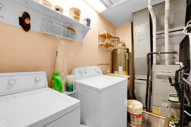 clothes washing area with water heater and washing machine and clothes dryer