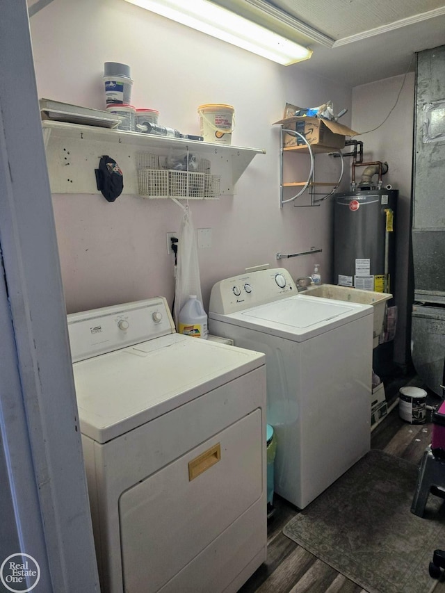 laundry area with sink, dark hardwood / wood-style flooring, separate washer and dryer, and water heater