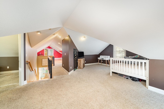 bedroom with carpet flooring and vaulted ceiling