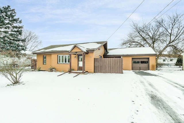 single story home featuring a garage