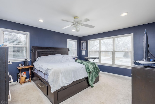 bedroom featuring light colored carpet and ceiling fan