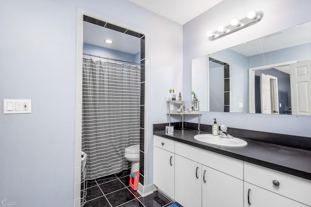 bathroom with tile patterned floors, vanity, toilet, and a shower with shower curtain