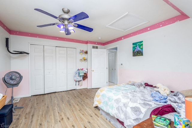 bedroom with ceiling fan, a closet, and light wood-type flooring