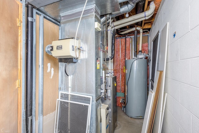 utility room featuring water heater