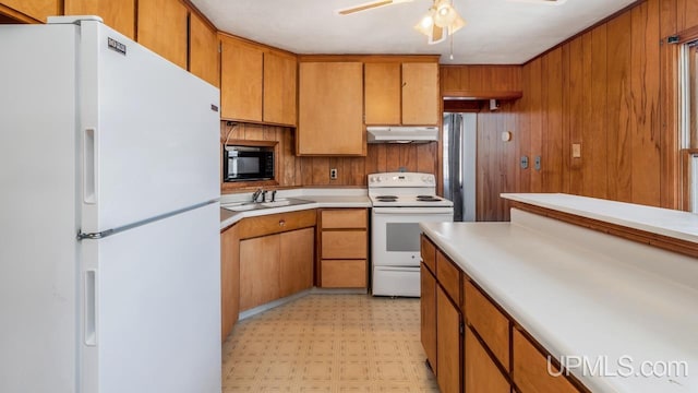 kitchen with ceiling fan, sink, and white appliances