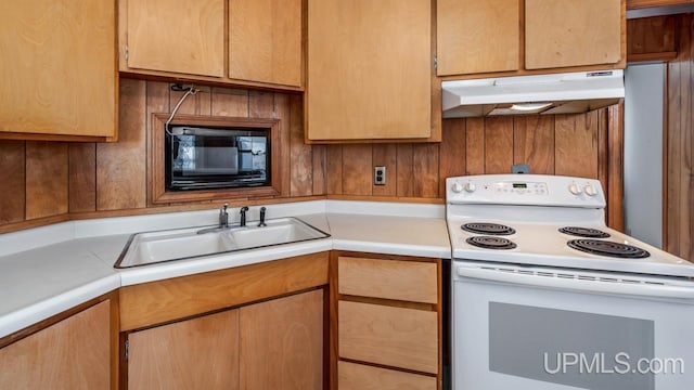 kitchen featuring sink, black microwave, and electric range