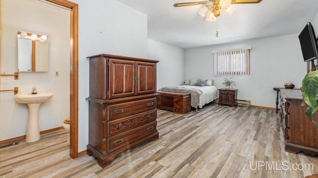 bedroom featuring ceiling fan and light hardwood / wood-style floors