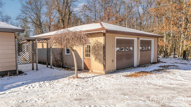 view of snow covered garage