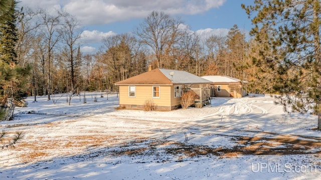 view of snow covered property