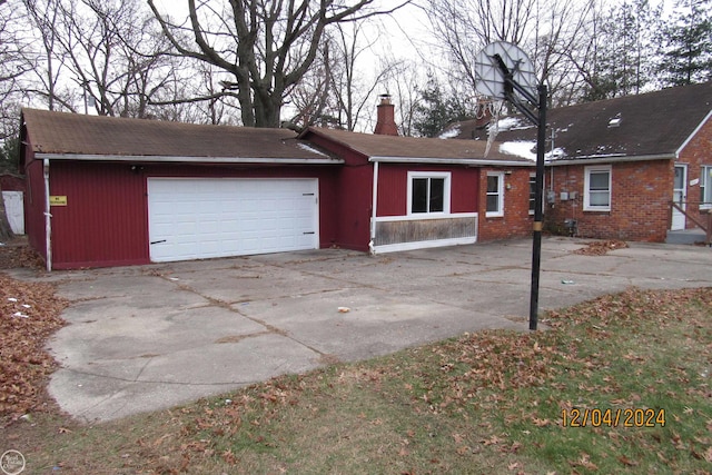 ranch-style house featuring a garage