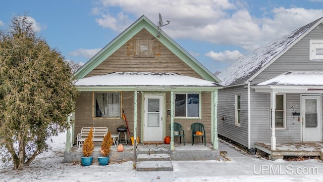 bungalow-style home with a porch