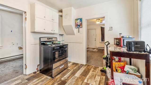 kitchen with white cabinetry, gas stove, dark hardwood / wood-style flooring, and a baseboard heating unit