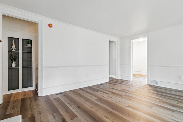 spare room featuring light wood-type flooring