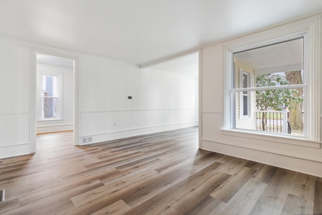 spare room with light wood-type flooring