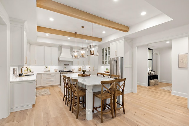 interior space with sink and light wood-type flooring