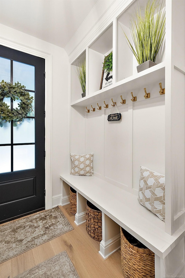 mudroom with hardwood / wood-style floors