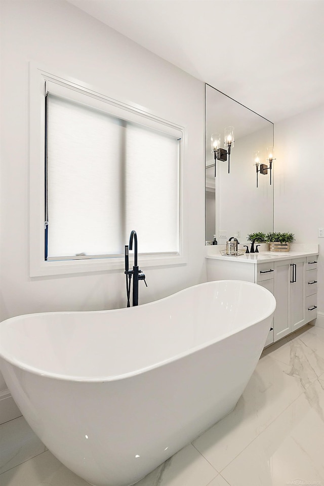 bathroom with a bath and vanity