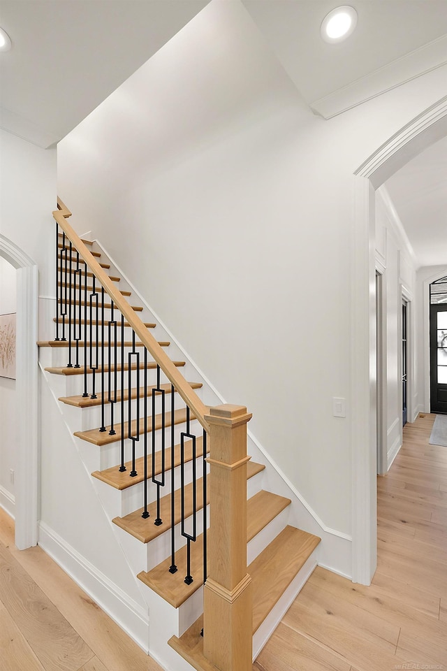 stairway featuring hardwood / wood-style flooring