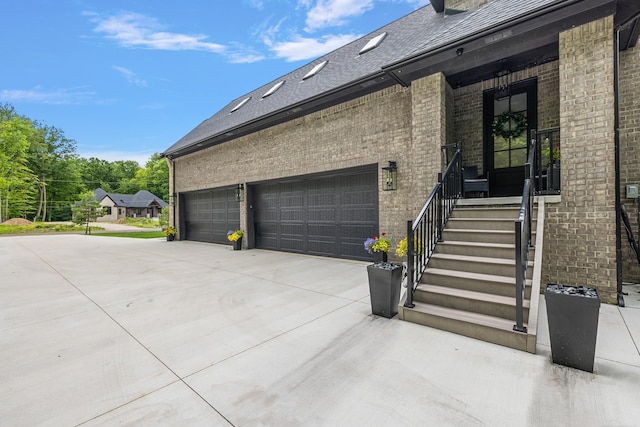 view of side of home featuring a garage