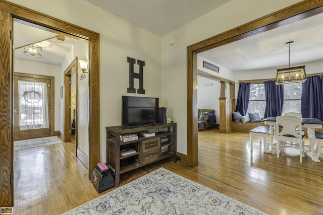 interior space featuring hardwood / wood-style floors and a notable chandelier