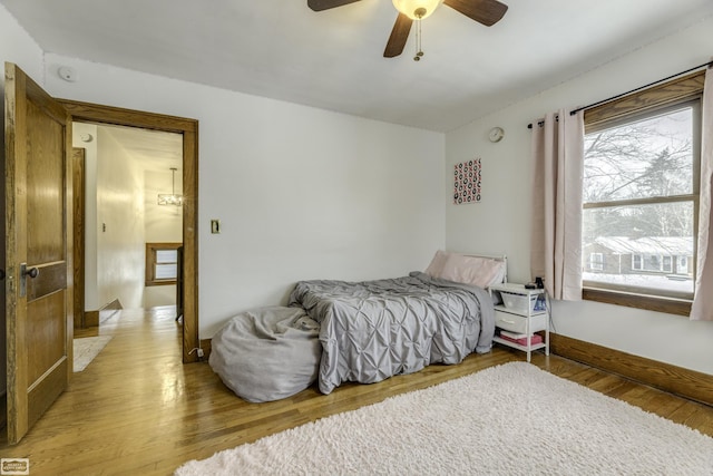 bedroom featuring ceiling fan and light hardwood / wood-style flooring