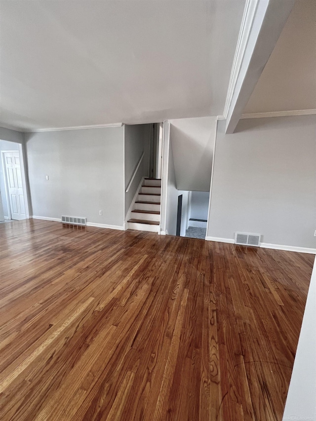 unfurnished living room with wood-type flooring