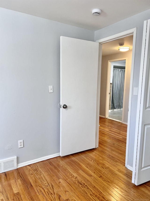 unfurnished room featuring light hardwood / wood-style flooring