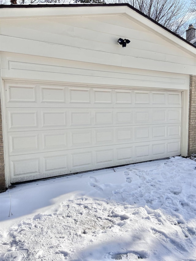 view of snow covered garage