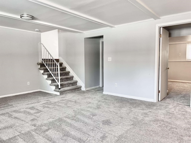 carpeted spare room featuring beamed ceiling and ornamental molding