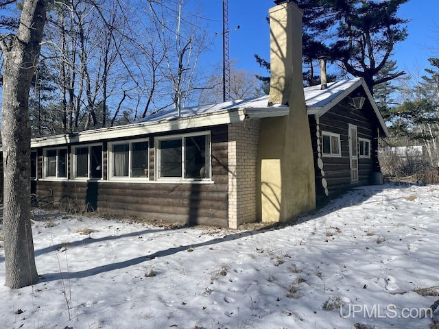 view of snow covered property