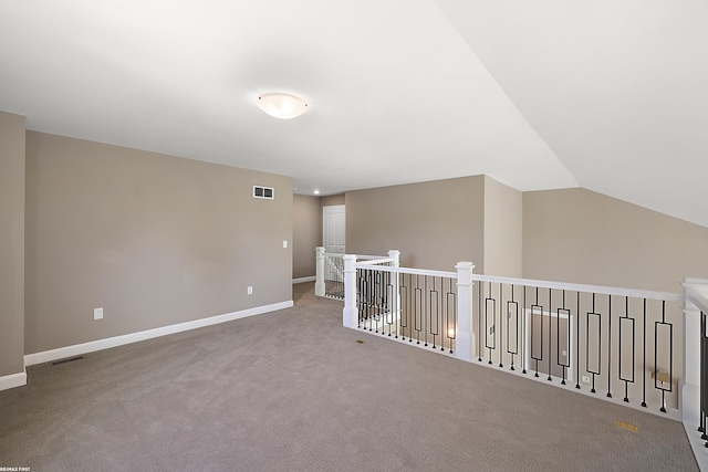 bonus room featuring vaulted ceiling and carpet flooring