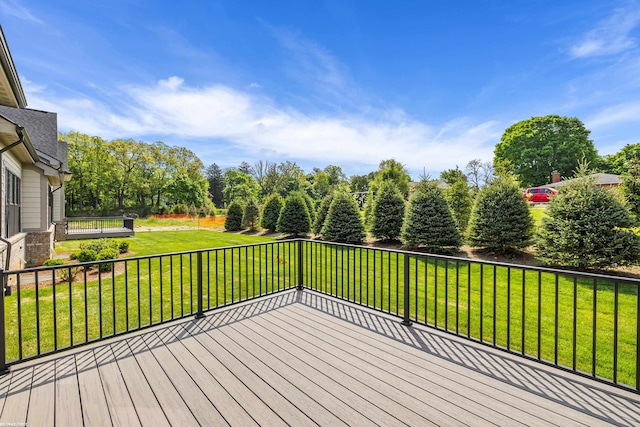 wooden terrace with a yard