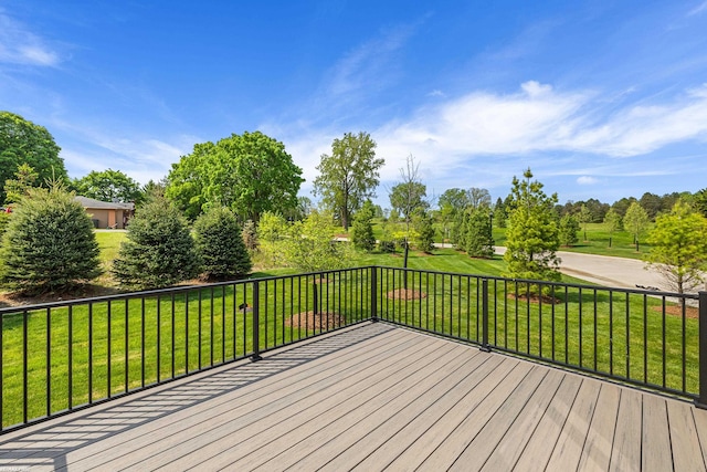 wooden deck with a yard