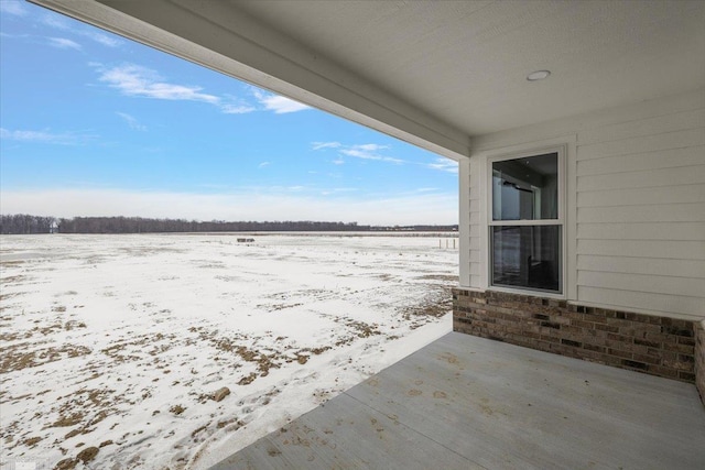 view of snow covered patio