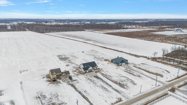 snowy aerial view featuring a rural view