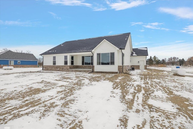 view of snow covered house