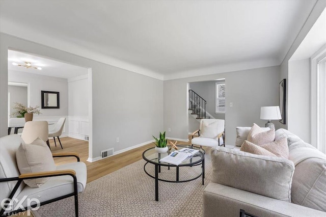 living room with light hardwood / wood-style flooring