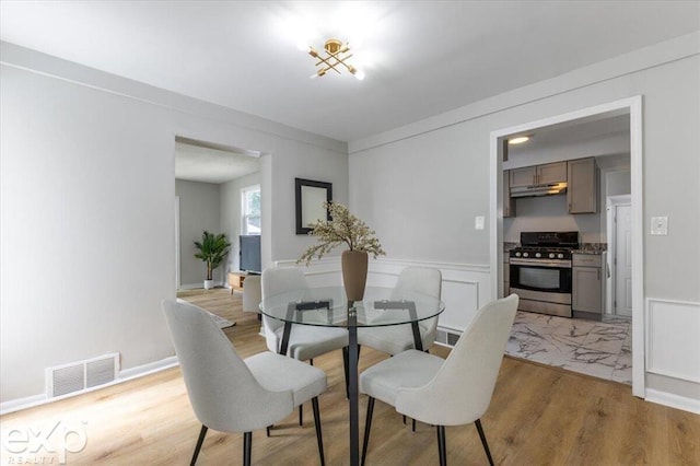 dining area with light hardwood / wood-style floors