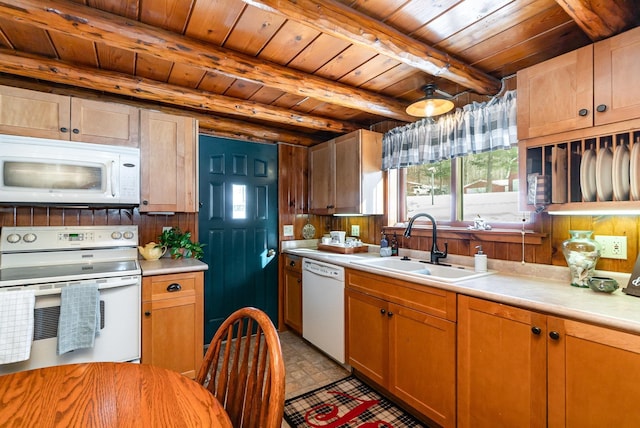 kitchen featuring beamed ceiling, white appliances, sink, and wooden ceiling