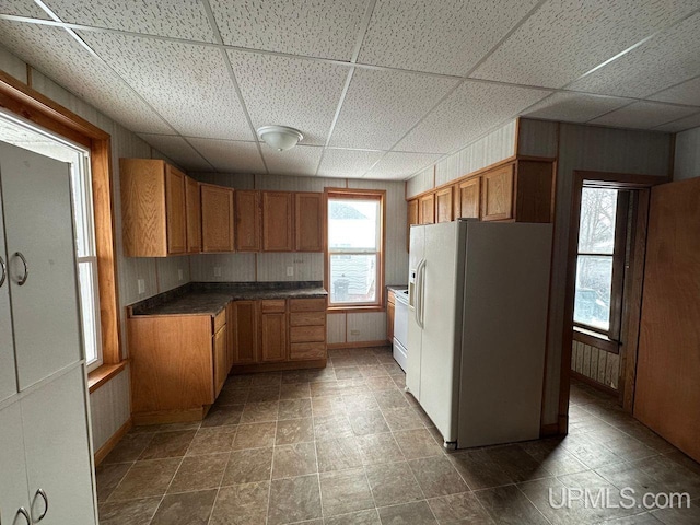 kitchen with white fridge with ice dispenser