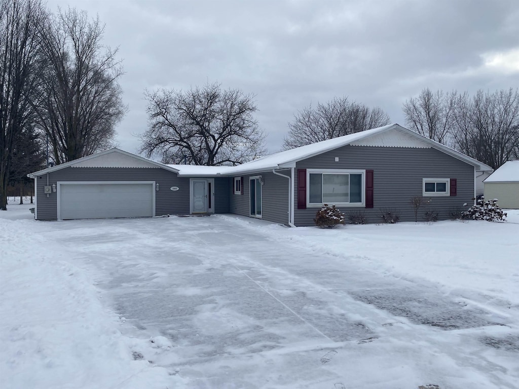 single story home featuring a garage