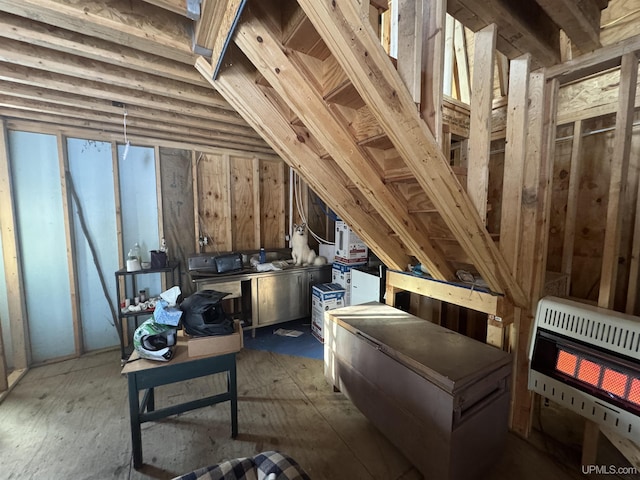 attic featuring heating unit