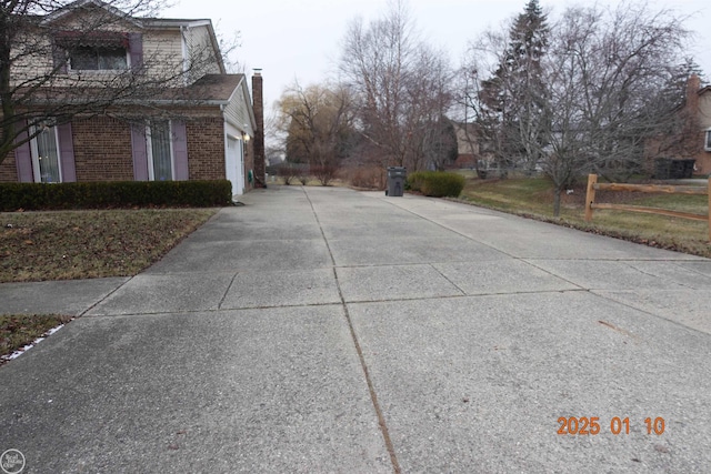 view of side of property featuring a garage