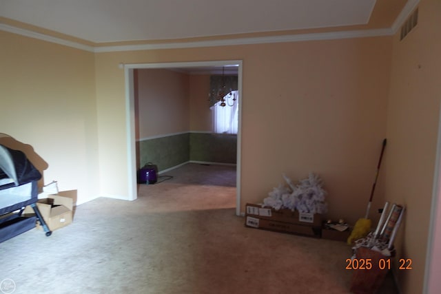 sitting room with crown molding and carpet floors