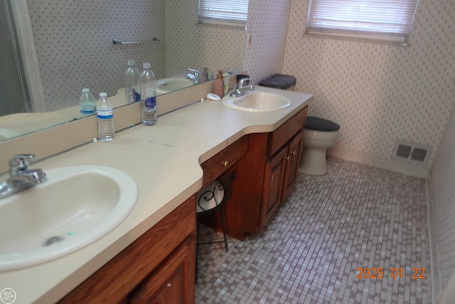 bathroom with vanity, toilet, and tile patterned flooring